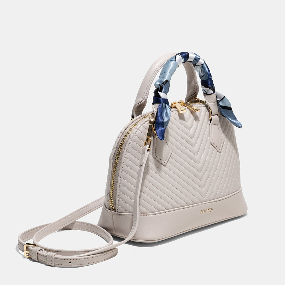 AMICA Junes Ladies Vegan Leather Dome Shaped Mini Crossbody Bag - Stone