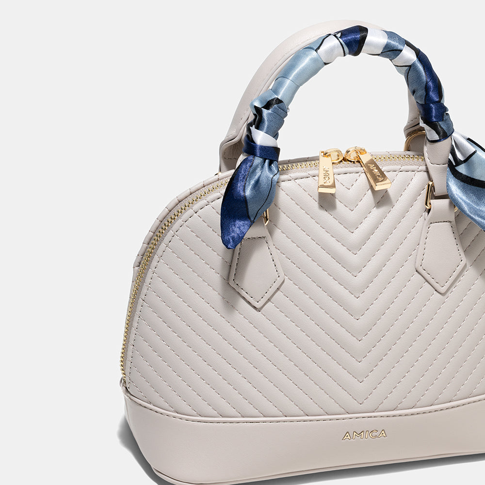 AMICA Junes Ladies Vegan Leather Dome Shaped Mini Crossbody Bag - Stone